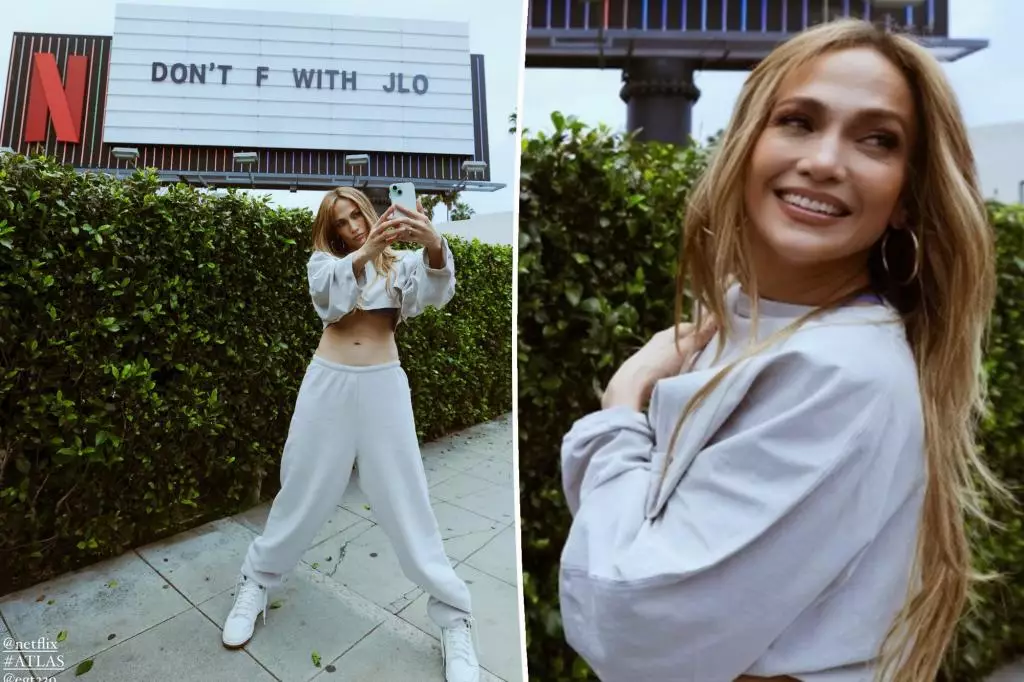Jennifer Lopez Stops to Take Photos in Front of Netflix’s ‘Atlas’ Billboard